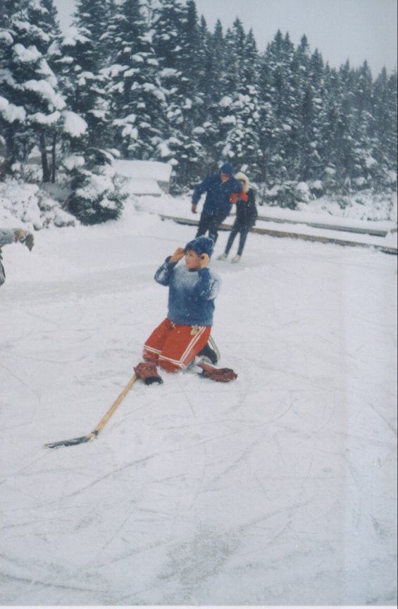 Children playing hockey and skating