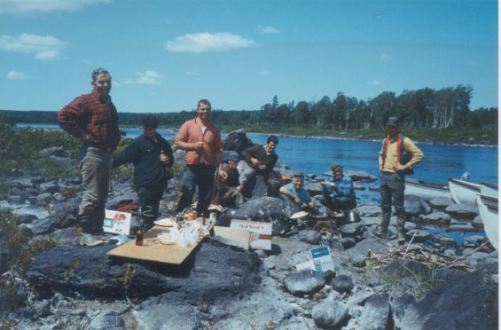Group of people on a rocky beach during a fishing trip with Harold L. Lake (not pictured)