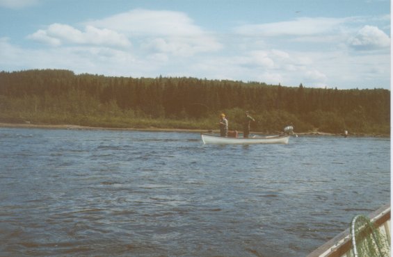Men fishing in a small boat