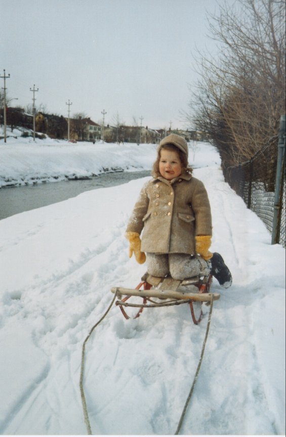 Harold L. Lake's daughter on a sled