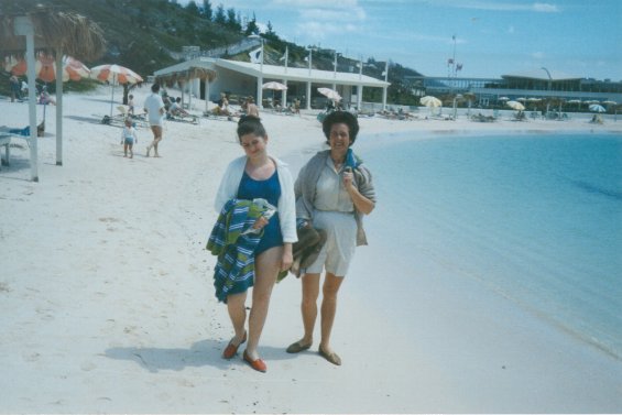 Harold L. Lake's wife, Robin, and her daughter on a sandy beach in St. George, Bermuda