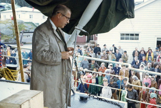 Spencer G. Lake giving a speech to a crowd of people in Gaultois, Newfoundland from the 