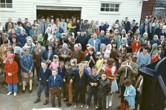 Crowd of people in Gaultois, Newfoundland, attending a speech given by Spencer G. Lake