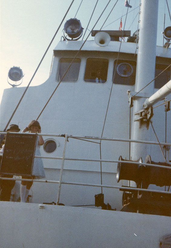 Two children standing on a ship