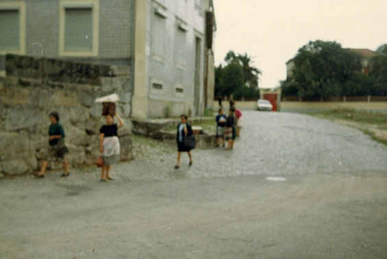 People walking on a street in an unknown location
