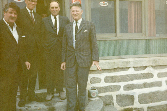 Harold L. Lake (left) with John T. Cheeseman (second from left) and two other men