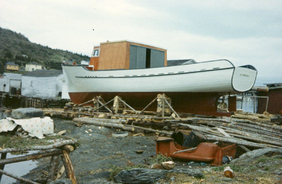 Small fishing boat registered in St. John's, Newfoundland laid up on a wharf