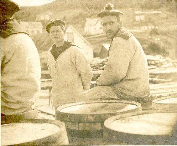 French sailors, sitting around on a wharf, possibly in Curling, Newfoundland