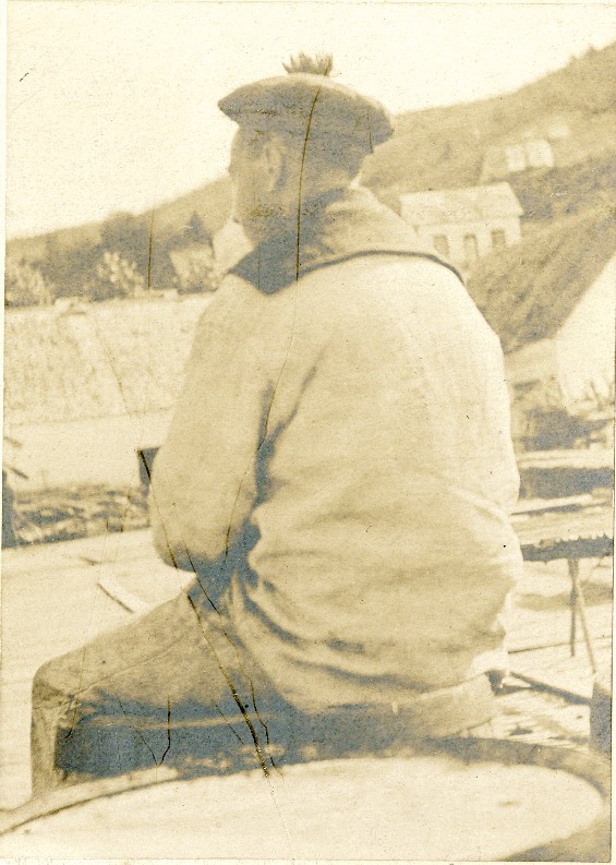 French sailor, sitting around on a wharf, possibly in Curling, Newfoundland