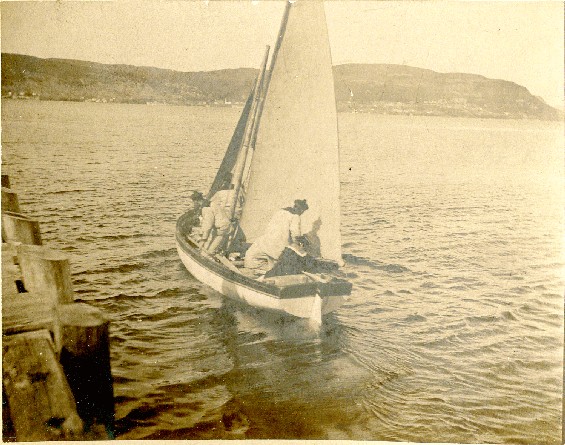 French sailors in a small sailboat in the Humber Arm, Bay of Islands, Newfoundland