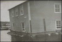 House of Albert Cluett, Sr. being moved<br>from Cape Cove to Tilting, June 1959