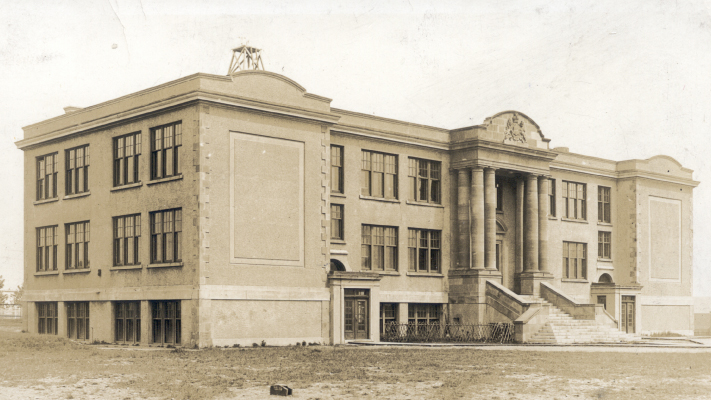 A black and white photograph of Memorial University College’s original Parade Street building