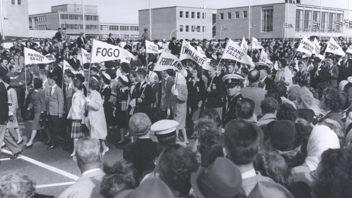 Highschool students carrying community flags parade along Elizabeth Avenue in St. John’s