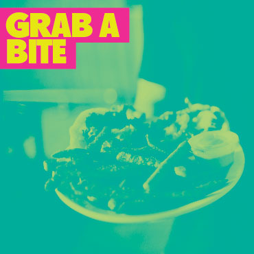 Yellow text with a pink background saying Grab a bite with a photo of a plate of food in the background with a green overlay.