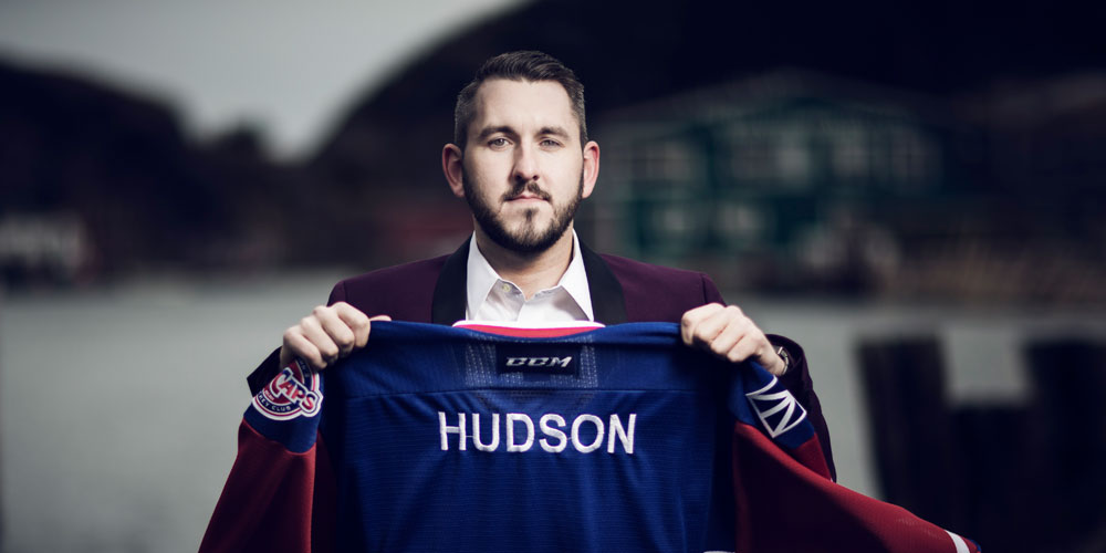 Greg O'Brien holding IceCaps Royal Newfoundland Regiment jersey