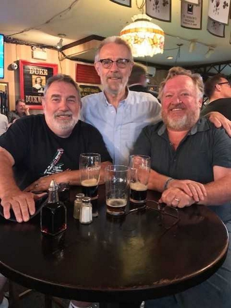 Gerry Penney, Tip Evans, and Steve Mills at a table