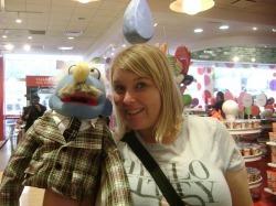 Amy Chase with a muppet/puppet toy