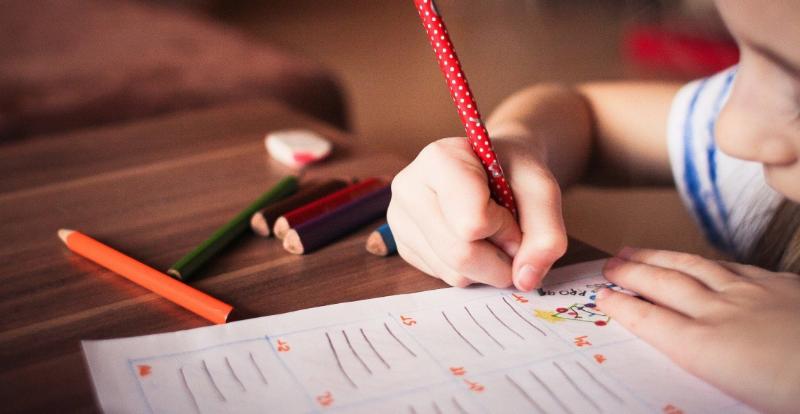 Image of child writing