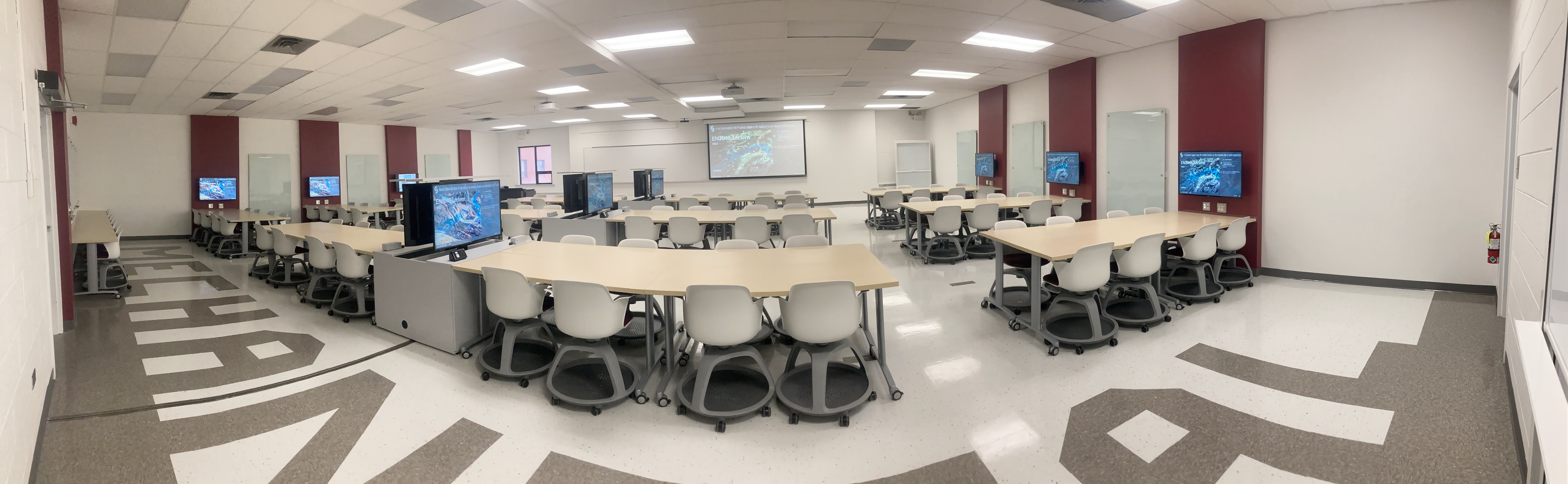 Newly renovated active classroom showing flexible tables and chairs that can move around.