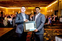 Nathan Ash receives his award from Praveen Jha, president of CIM Newfoundland Branch