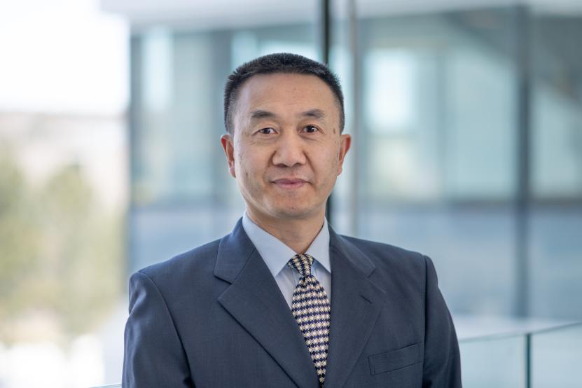 Man wearing suit and tie looking at camera