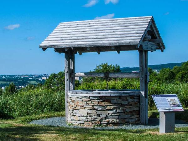 an old stone well sits in Geo Vista Park