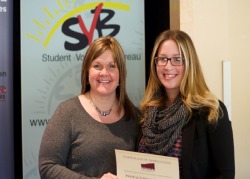 Dr. Anne-Marie Sullivan presents the PLE certificate to kin student Sarah Hansford