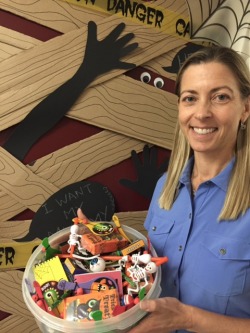 Dr. Kilborn with bowl of Halloween treats