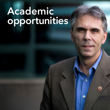 A man with a blue shirt and brown blazer is shown with the words Academic Opportunities displayed on the top left of the image.