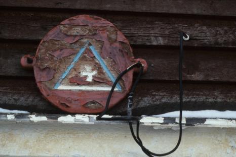 Hand carved grub bucket cover with SUF (Society of Unionized Fishermen) Lodge logo, in William Payne's stage, Town of Fogo 