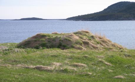 Root cellar in the foreground with the harbour mouth in the distance, Seldom-Come-By 