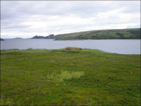 Another southeast view of old fisher house foundation with sod house in the background.