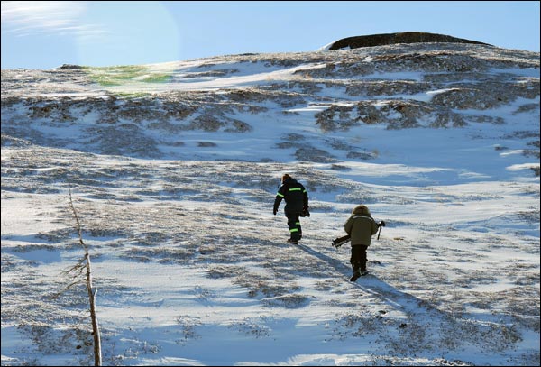 Derek Norman and Mario Blaser heading up to film from the top of the hill at Indian Harbour