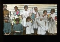 School children holding hand made objects, 1915