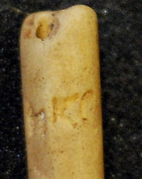 Kaolin pipe stem with initials HKC(?)