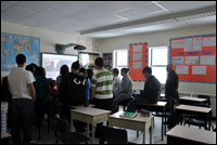 Derek Norman leads a workshop in video editing at the Cartwright high school