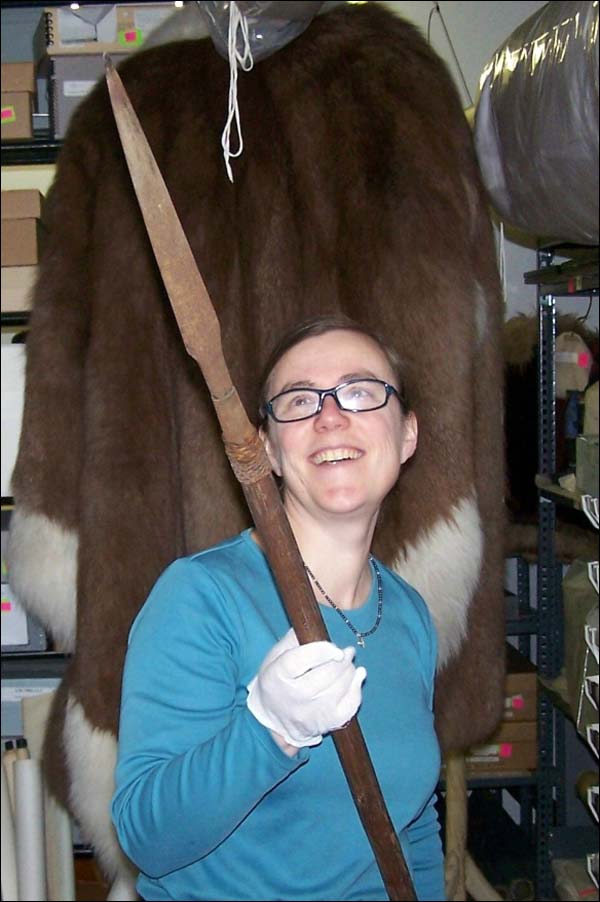 Curator of the Peary-Macmillan Arctic Museum, Genevieve LeMoine, holding a lance
