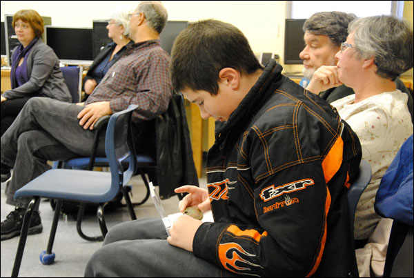 Boy examining an object