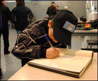 Boy Writing in a Book