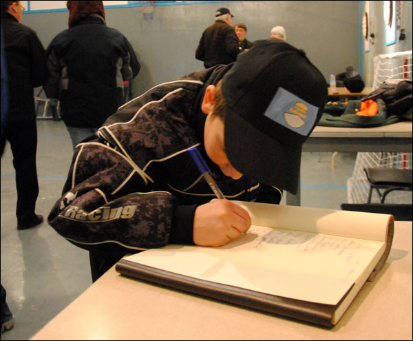 Boy writing in a book