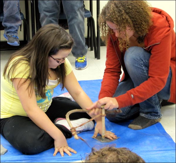 Michelle Davies and Girl with Bow Drill