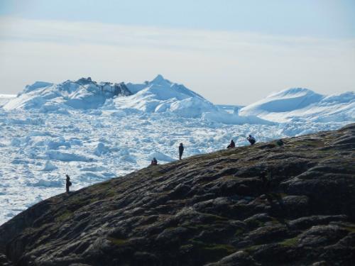 An educational visit to a glacier in Ilulissat, Kalaallit Nunaat (Greenland), during the 2015 Students on Ice program