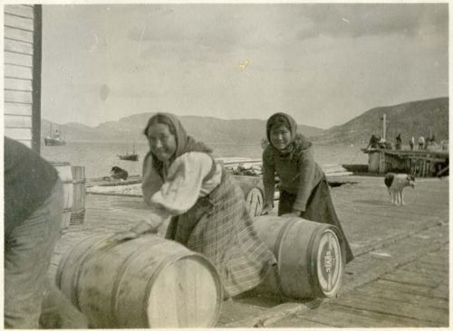 two girls rolling barrels