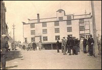 Parade day at Port Union with eastern facade of the Fishermen's Union Trading Company store in background.