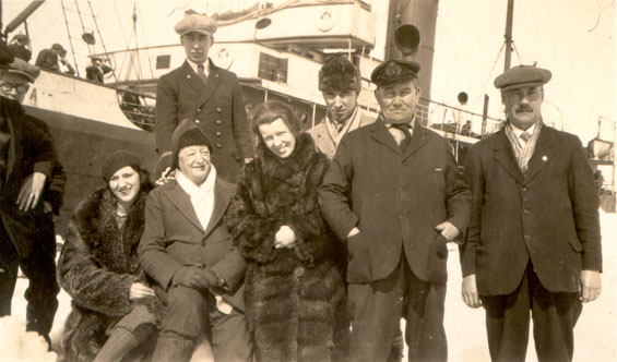 Seven men and two women standing near the S.S. "Sagona"