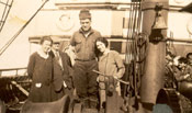 Two men and two women on the deck of a vessel