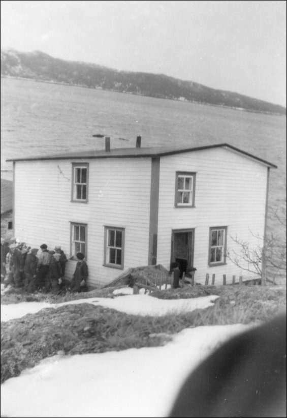 Launching Alex and Annie Stacey house on Sound Island, Placentia Bay