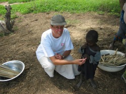 Dr. Donna Moralejo with a five-year-old boy in Burkina Faso, West French Africa. The child was immunized during the WHO's Stop Transmission of Polio project.