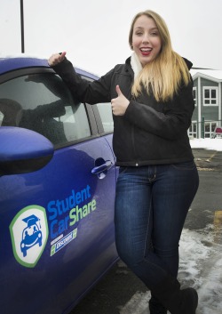 School of Nursing student Emily Loder checks out the new Student CarShare vehicle on campus.