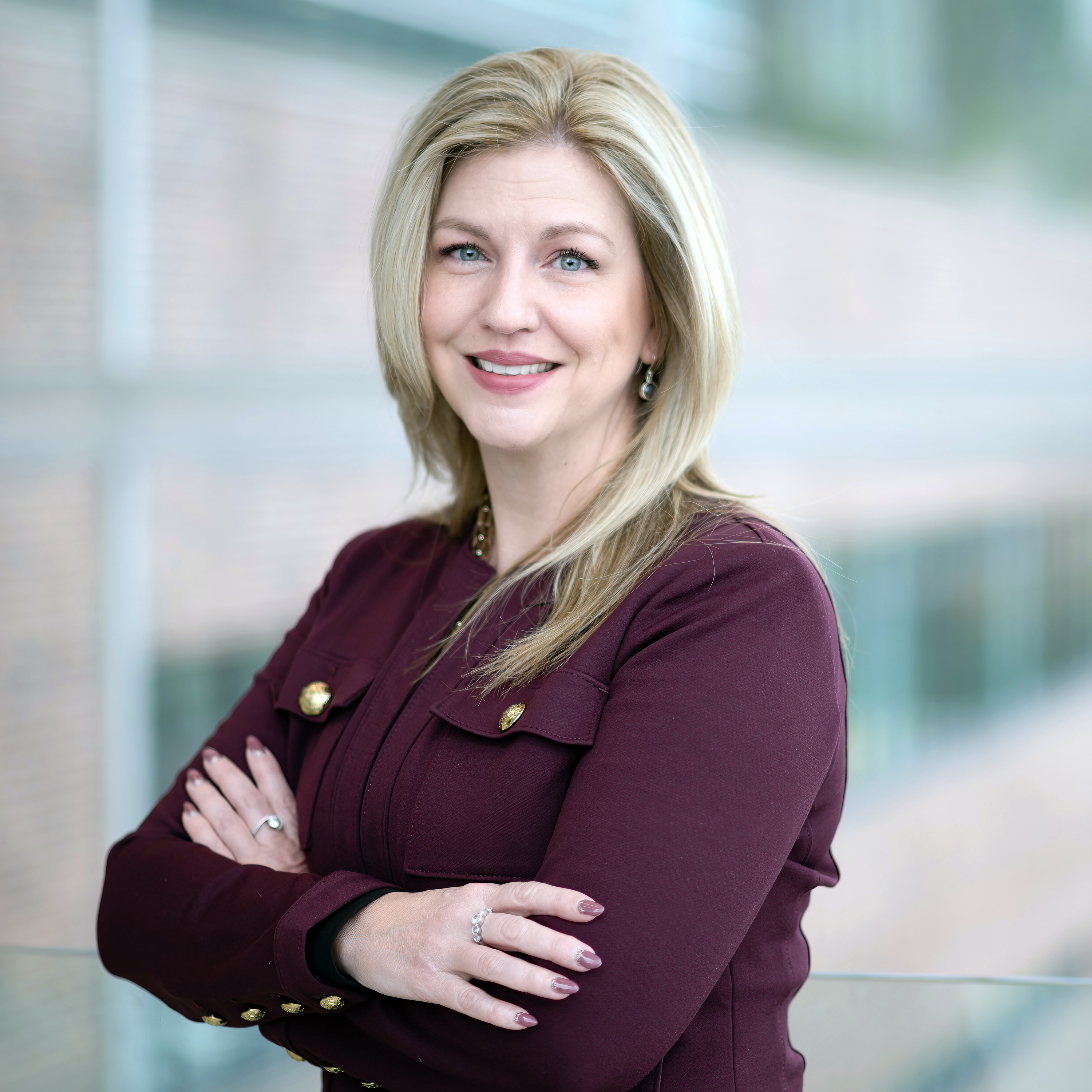 Photo of Dr. Debbie Kelly, a mom, pharmacist and professor at the School of Pharmacy. Clinic director at the MTS Clinic. Photo taken in the glass atrium of the Med School at MUN.